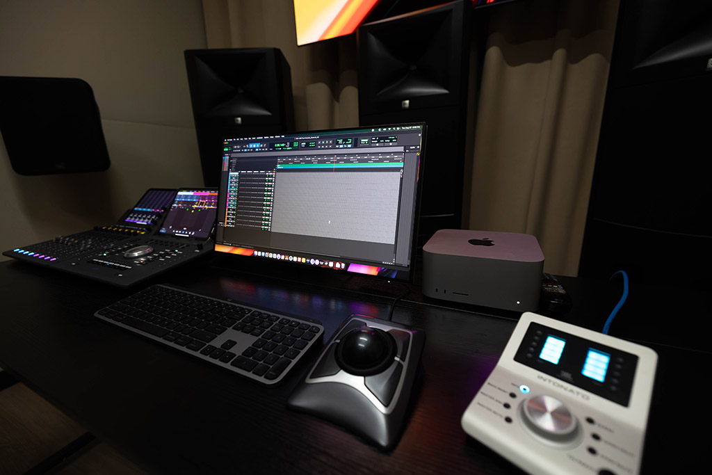 Close up shot of the trackball and JBL Intonado controller on the desk in Suite One.